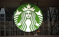 FILE - This Thursday, Jan. 12, 2017, file photo shows a Starbucks logo sign in the window of one of the chain's cafes in Pittsburgh.  Starbucks reports their earnings on Tuesday, Jan. 30, 2024.  (AP Photo/Gene J. Puskar, File)