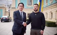 Ukraine's President Volodymyr Zelenskiy and Japan Prime Minister Fumio Kishida shake hands as they meet, amid Russia's attack on Ukraine, in Kyiv, Ukraine March 21, 2023. Ukrainian Presidential Press Service/Handout via REUTERS ATTENTION EDITORS - THIS IMAGE HAS BEEN SUPPLIED BY A THIRD PARTY.
