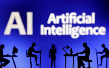 FILE PHOTO: Figurines with computers and smartphones are seen in front of the words "Artificial Intelligence AI" in this illustration taken, February 19, 2024. REUTERS/Dado Ruvic/Illustration/File Photo