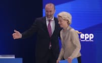 Germany's Manfred Weber, head of the Group of the European People's Party, left, congratulates European Commission President Ursula von der Leyen after her speech at the EPP Congress in Bucharest, Romania, Thursday, March 7, 2024. The 2024 EPP Congress designated Germany's Ursula von der Leyen, who seeks a second term as head of the European Union's powerful Commission, as the party's lead candidate in the upcoming European elections. (AP Photo/Andreea Alexandru)
