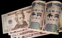 FILE PHOTO: Banknotes of Japanese yen and U.S. dollar are seen in this illustration picture taken September 23, 2022. REUTERS/Florence Lo/File Photo