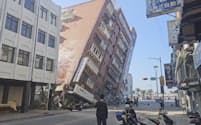 In this image taken from a video footage run by TVBS, a partially collapsed building is seen in Hualien, eastern Taiwan on Wednesday, April 3, 2024. A powerful earthquake rocked the entire island of Taiwan early Wednesday, collapsing buildings in a southern city and creating a tsunami that washed ashore on southern Japanese islands.(TVBS via AP)