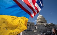 Flags flutter as pro-Ukrainian supporters demonstrate outside the U.S. Capitol after the U.S. House of Representatives voted on legislation providing $95 billion in security assistance to Ukraine, Israel and Taiwan, at Capitol Hill in Washington, U.S., April 20, 2024. REUTERS/Ken Cedeno