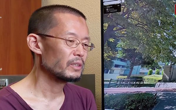 5日、ベラルーシ国営放送が放映した特別番組で話す中西雅敏さん=同放送提供・共同