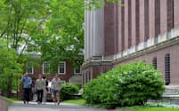 FILE PHOTO: Students walk on the campus of Harvard University in Cambridge, Massachusetts, U.S., May 23, 2025. REUTERS/Faith Ninivaggi/File Photo