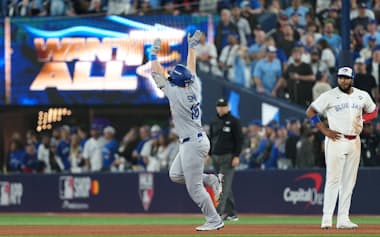 Nov 1, 2025; Toronto, Ontario, CAN; Los Angeles Dodgers catcher Will Smith (16) reacts after hitting a home run against the Toronto Blue Jays in the eleventh inning for game seven of the 2025 MLB World Series at Rogers Centre. Mandatory Credit: Nick Turchiaro-Imagn Images