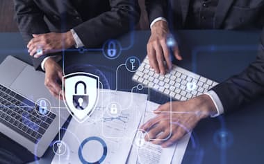 Two businesspeople man and woman working on the project to protect cyber security of international company. Padlock Hologram icons over the table with documents. Formal wear. Workspace.