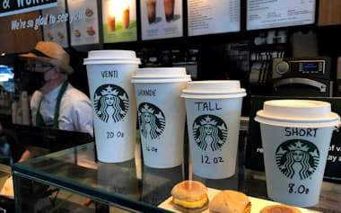 FILE PHOTO: Starbucks cups are pictured on a counter in the Manhattan borough of New York City, New York, U.S., February 16, 2022. REUTERS/Carlo Allegri/File Photo