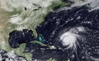 ストームクエイクを生み出すには、条件に合う海底地形がある場所を巨大な嵐が襲う必要がある。例えば、この2009年の衛星画像に映るハリケーン「ビル」は、ニューイングランド沖のジョージズ・バンクを通過する際にストームクエイクを引き起こした（PHOTOGRAPH BY NOAA VIA GETTY IMAGES）