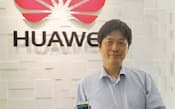 図2　華為技術日本でHuawei Technologiesの日本市場向け携帯端末を開発する菅原史朗氏。20年ほど勤めた大手電機メーカーを辞め、2012年6月に華為技術日本に転職した