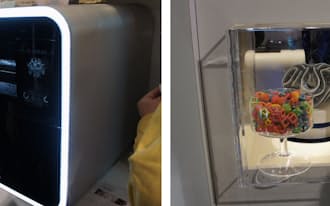 左は、3D Systemsの3D"フード"プリンター「ChefJet Pro」。右は、同プリンターで出力したお菓子。「2014 International CES」に出展した様子（写真:日経エレクトロニクス）