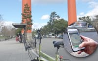 スマートフォンのアプリ（写真の円内）から呼び出して、その場で自転車を借りられる